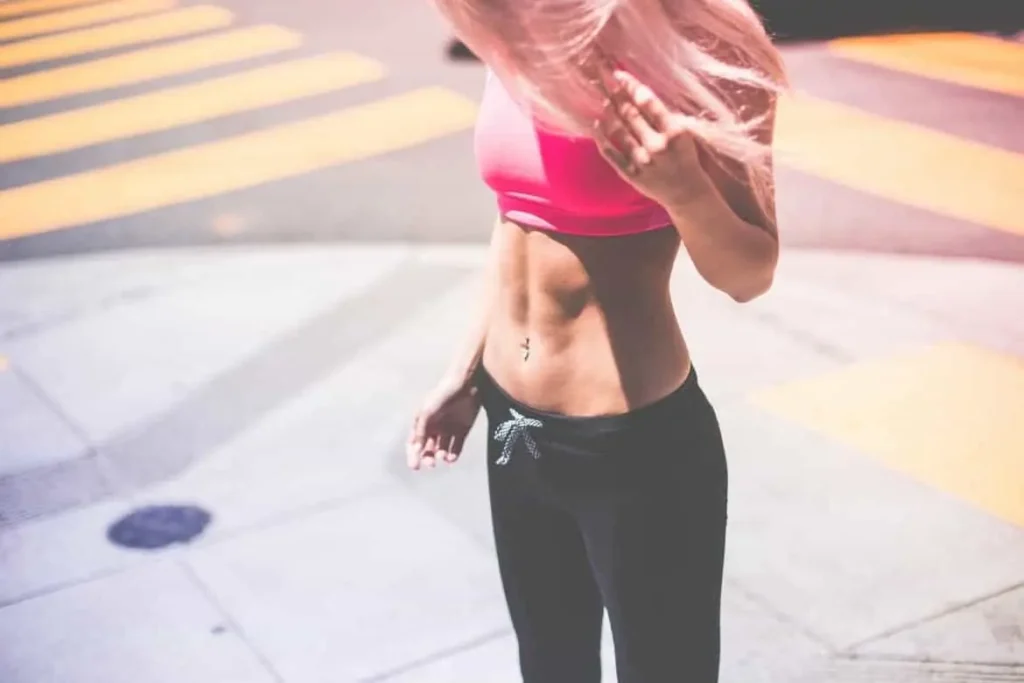 Woman with toned stomach after LA-EMS Body Sculpting Treatment Ramsey 